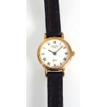 A 9ct yellow gold ladies wristwatch by Rotary, the circular white dial with black Roman numerals