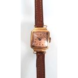An early 20th ladies 18ct yellow gold wristwatch by Ancre, the square copper coloured dial with