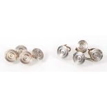 A pair of 18ct two-colour gold cufflink's or circular form, each set a small diamond, together