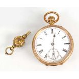 An 18ct yellow gold open face fob watch, the white enamel dial with black Roman numerals and