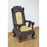 A Chinese Export carved padauk throne-type armchair with dragons head handles and claw