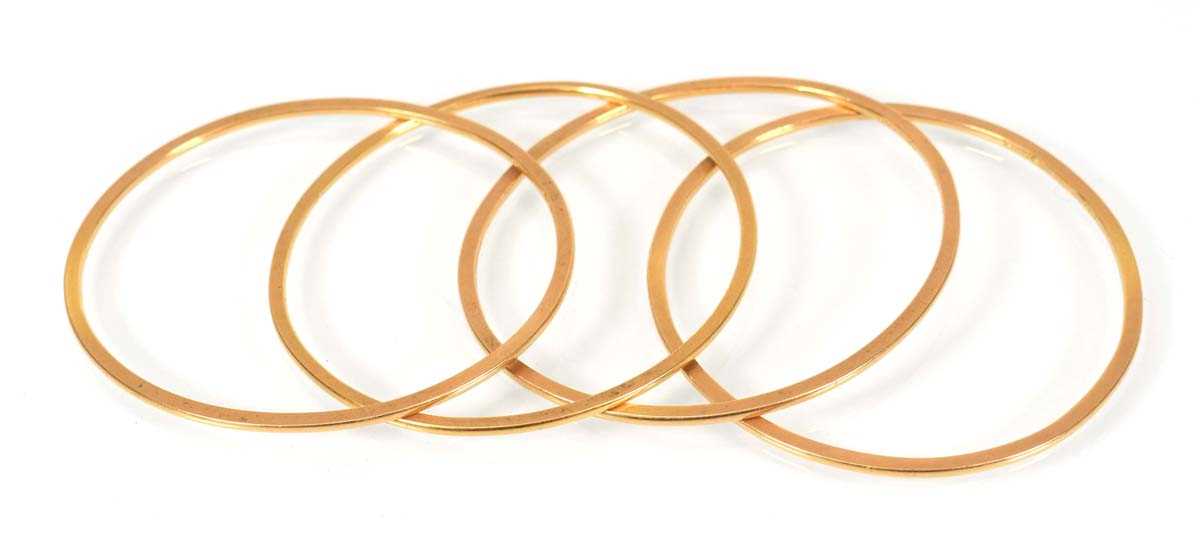 A set of four yellow metal bangles, internal d. approx. 6 cm, overall 38.4 gms (4) (af)Bangles