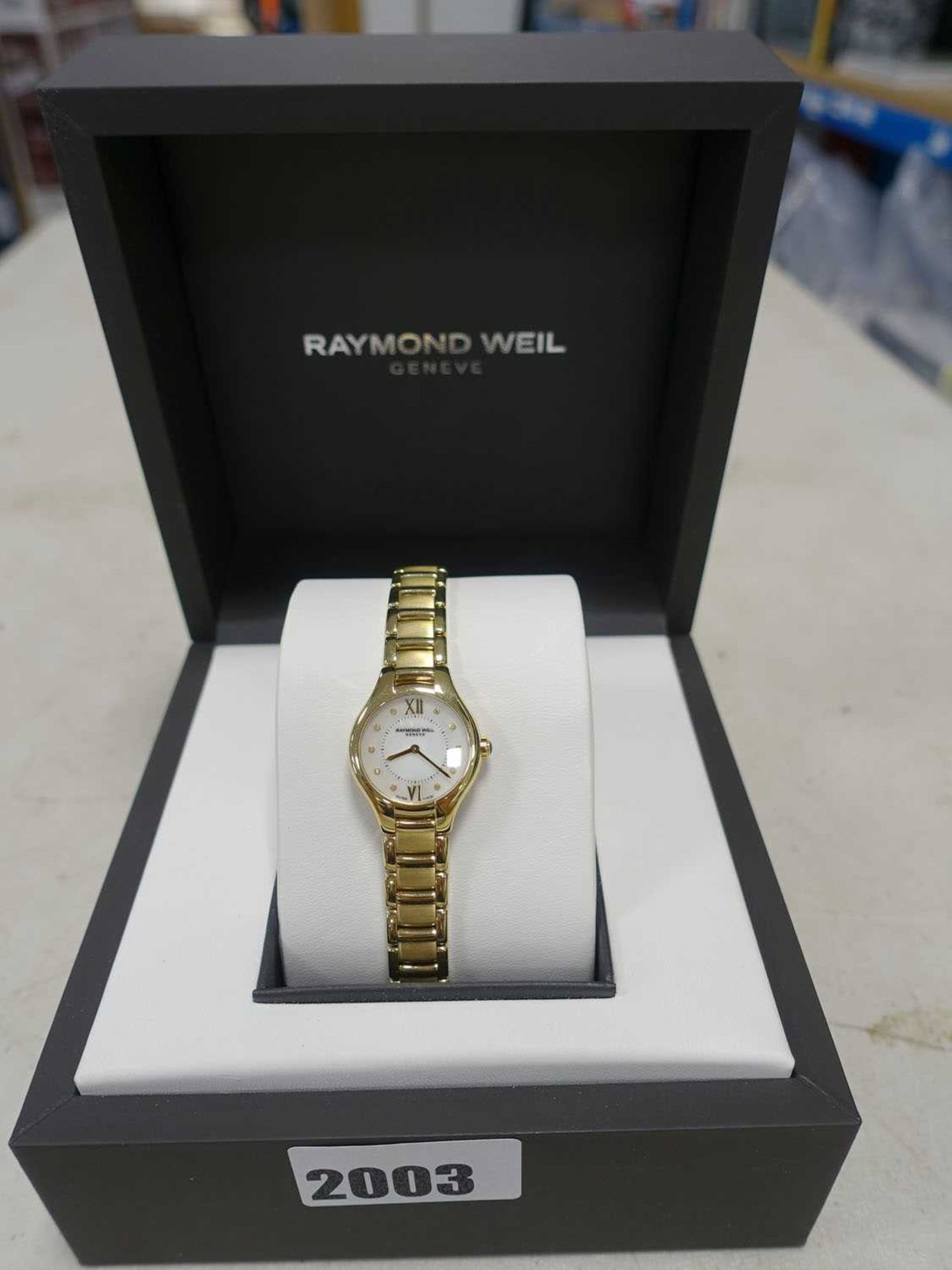 Ladies Raymond Weil roman numeral face dial gold tone stainless steel strap wristwatch