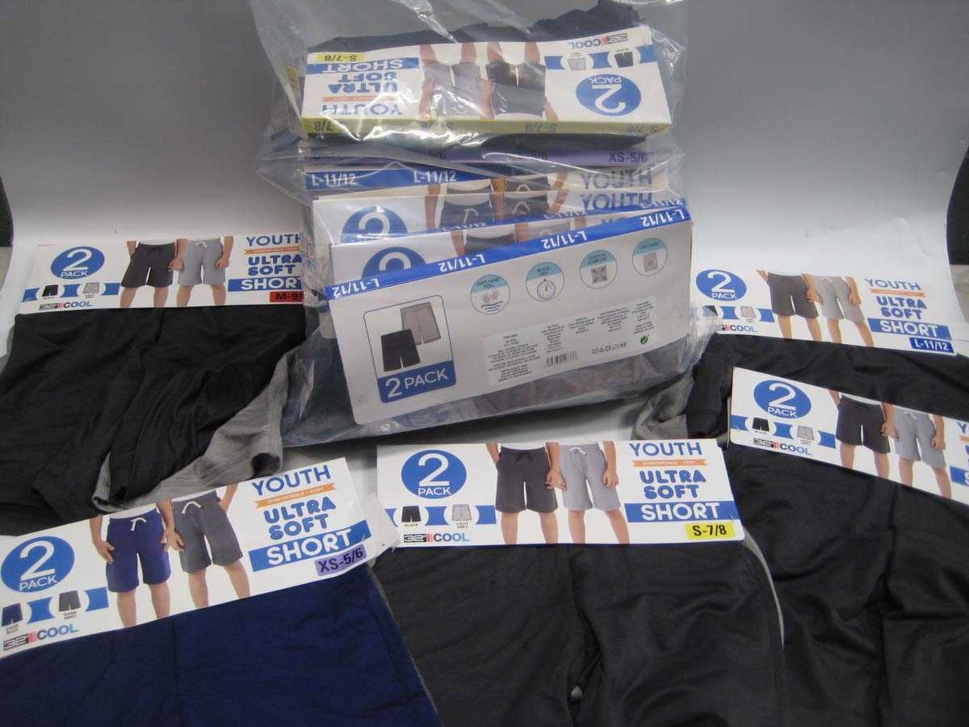 A bag containing 20x Sets of 2 Boys Shorts in various colours & sizes