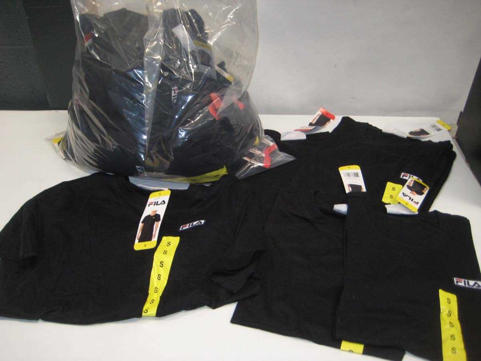 +VAT A bag containing Men's Black Fila T Shirts in various sizes.