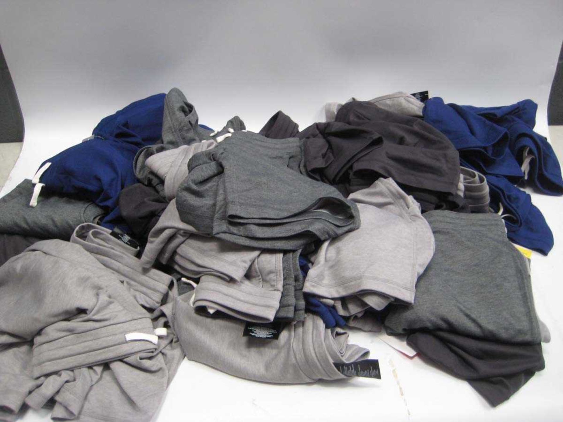 A bag containing a large quantity of Children's Shorts in various colours and sizes