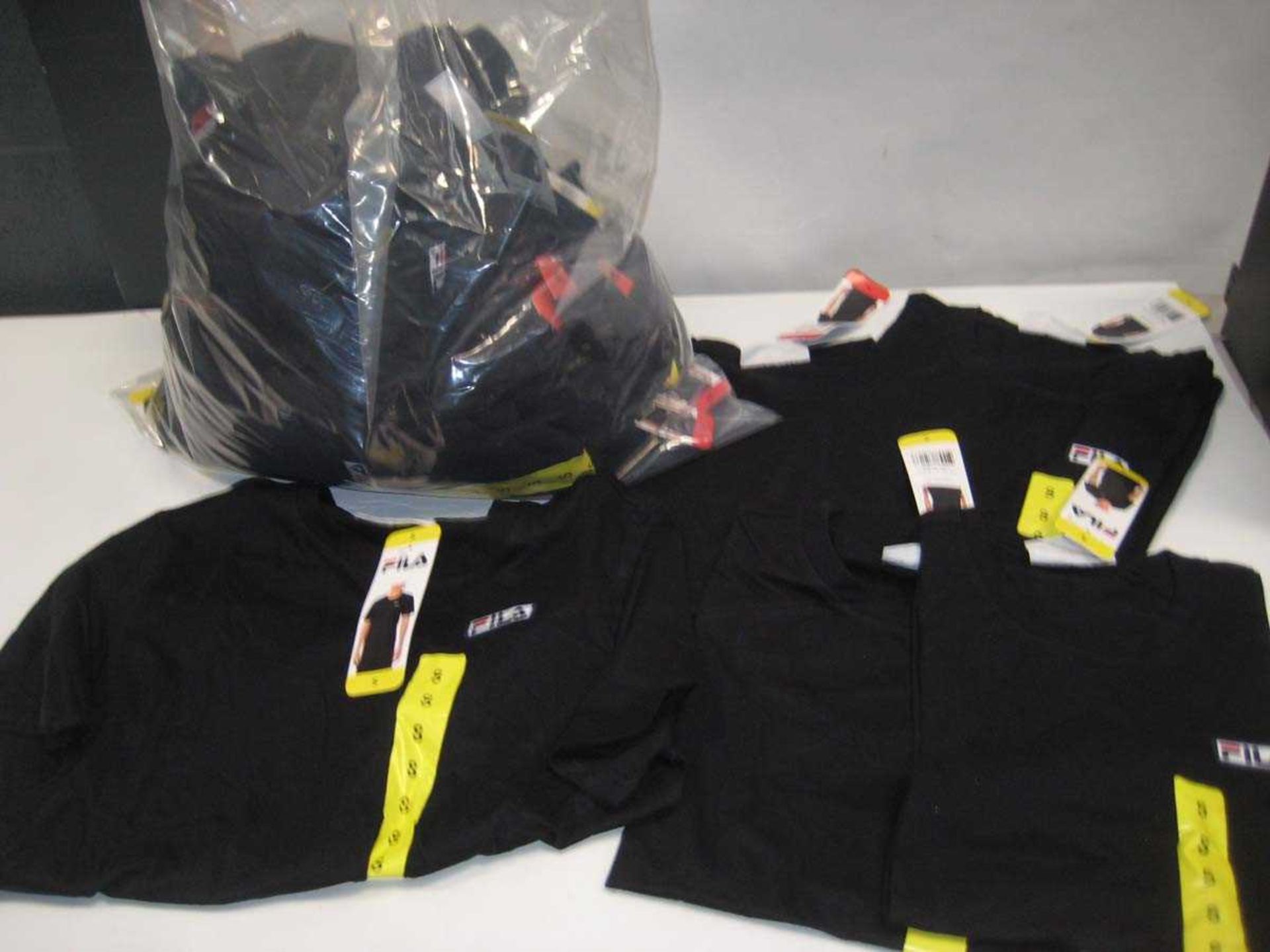 +VAT A bag containing Men's Black Fila T Shirts in various sizes.