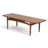 In the manner of Grete Jalk, a 1960's teak and crossbanded surfboard-style coffee table, 137 x 49