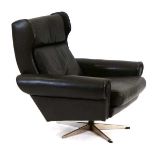 A 1960's Danish leather wingback armchair by Skippers Mobler on a five-star base*Sold subject to our