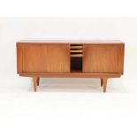 A 1960's Danish teak sideboard by Bernhard Pedersen & Son, the two tambour doors enclosing fitted