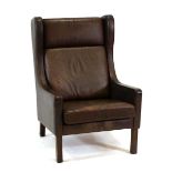 A 1960's Danish dark brown leather wingback armchair on square straight legs*Sold subject to our