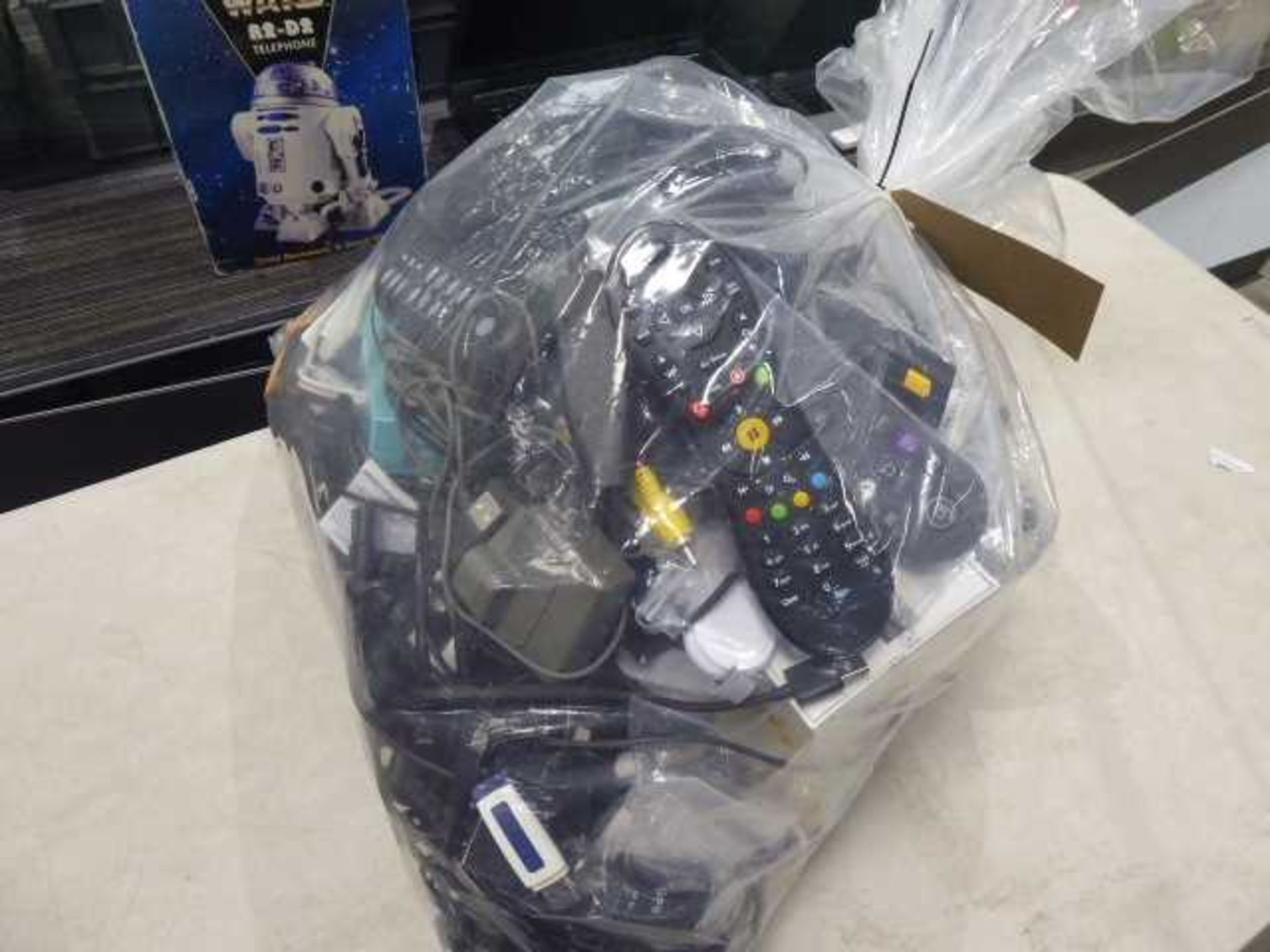 Bag of various electric sundries to include replacement remote controls, apateors, cables etc - Image 2 of 2