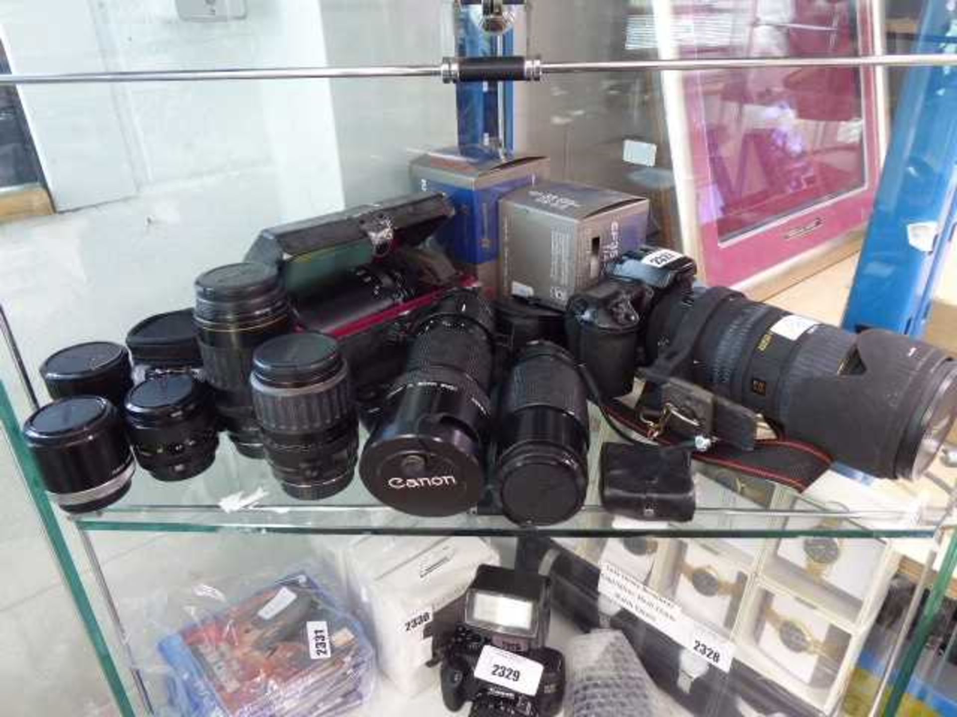 Canon EOS10 film camera body together with a wide selection of Canon lenses and Sigma lenses for