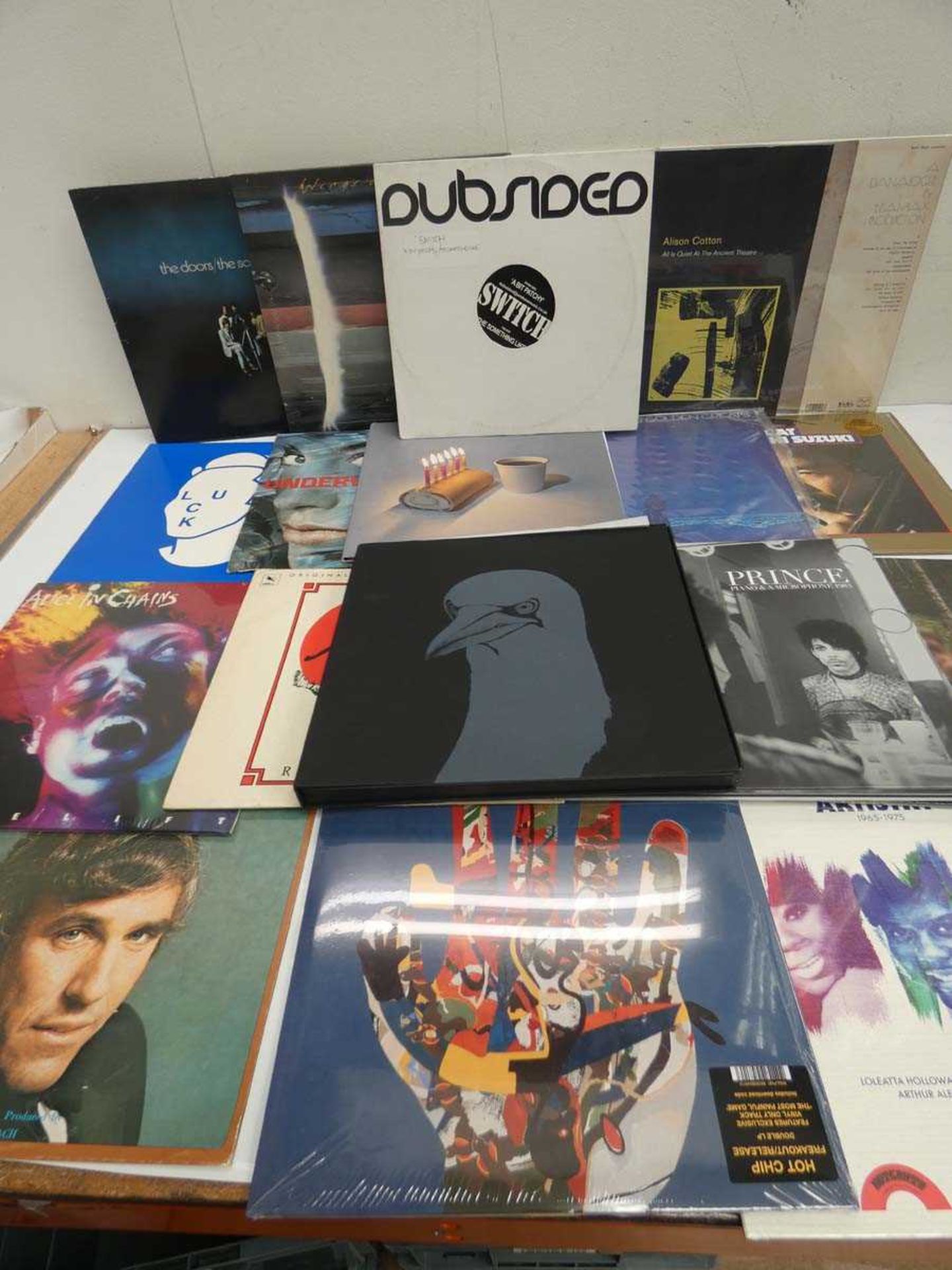 +VAT Box containing LP and 45 vinyl records to include The Doors, Prince, Alice in Chains and