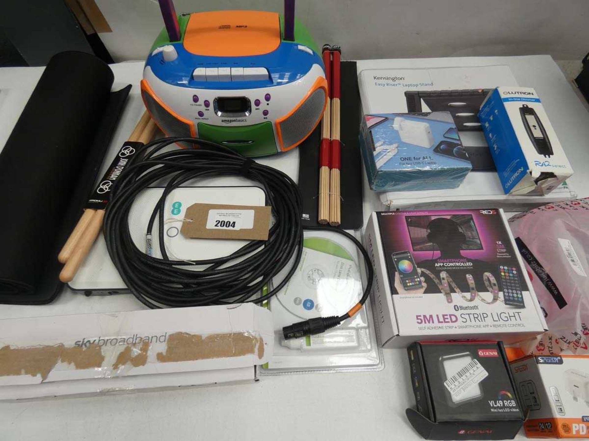 +VAT Mixed lot containing gaming mouse mat, strip lights, AmazonBasics CD player, laptop stand,