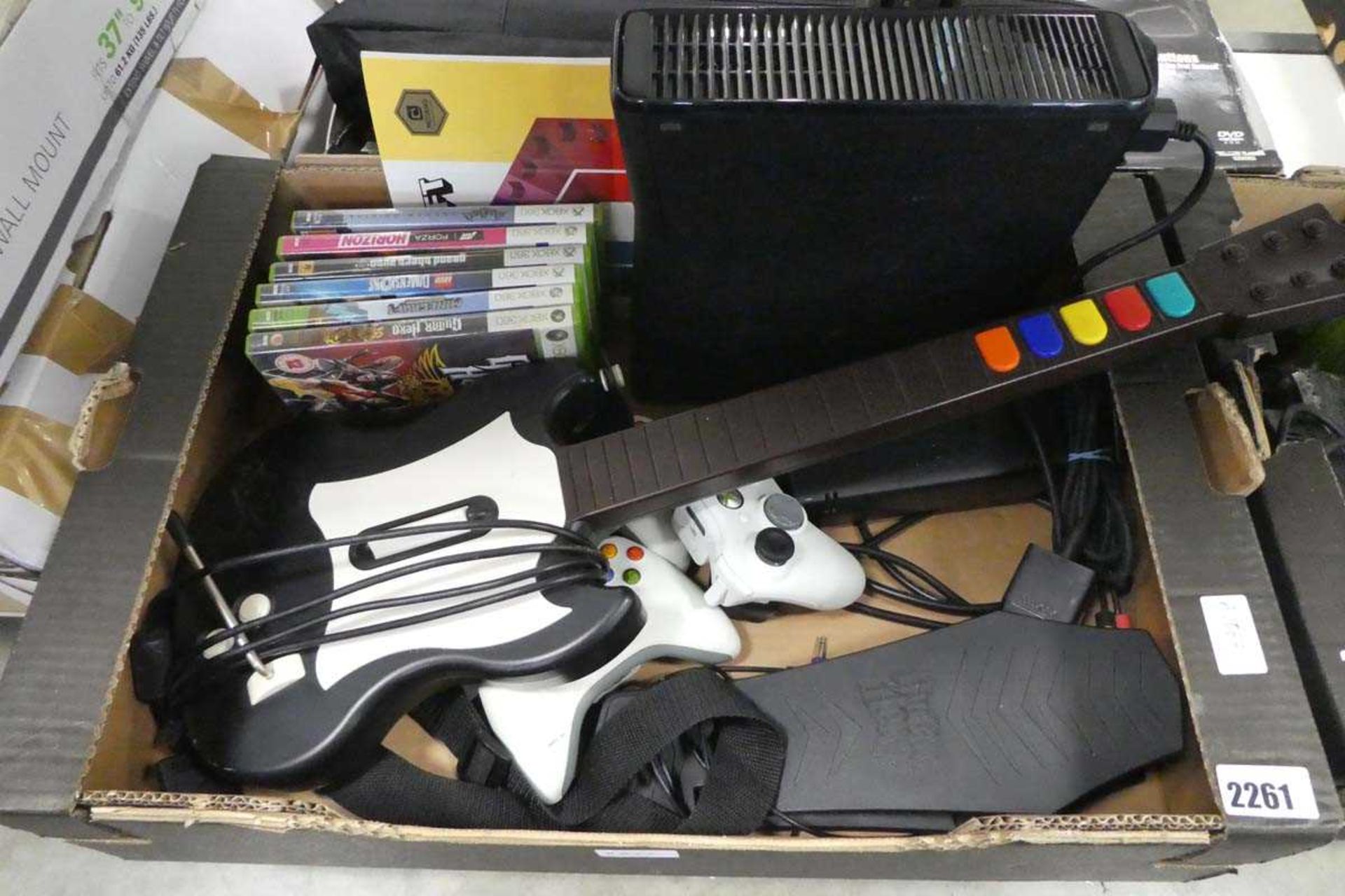 X box 360 games console with power cables, controllers, games and Guitar Hero accessory