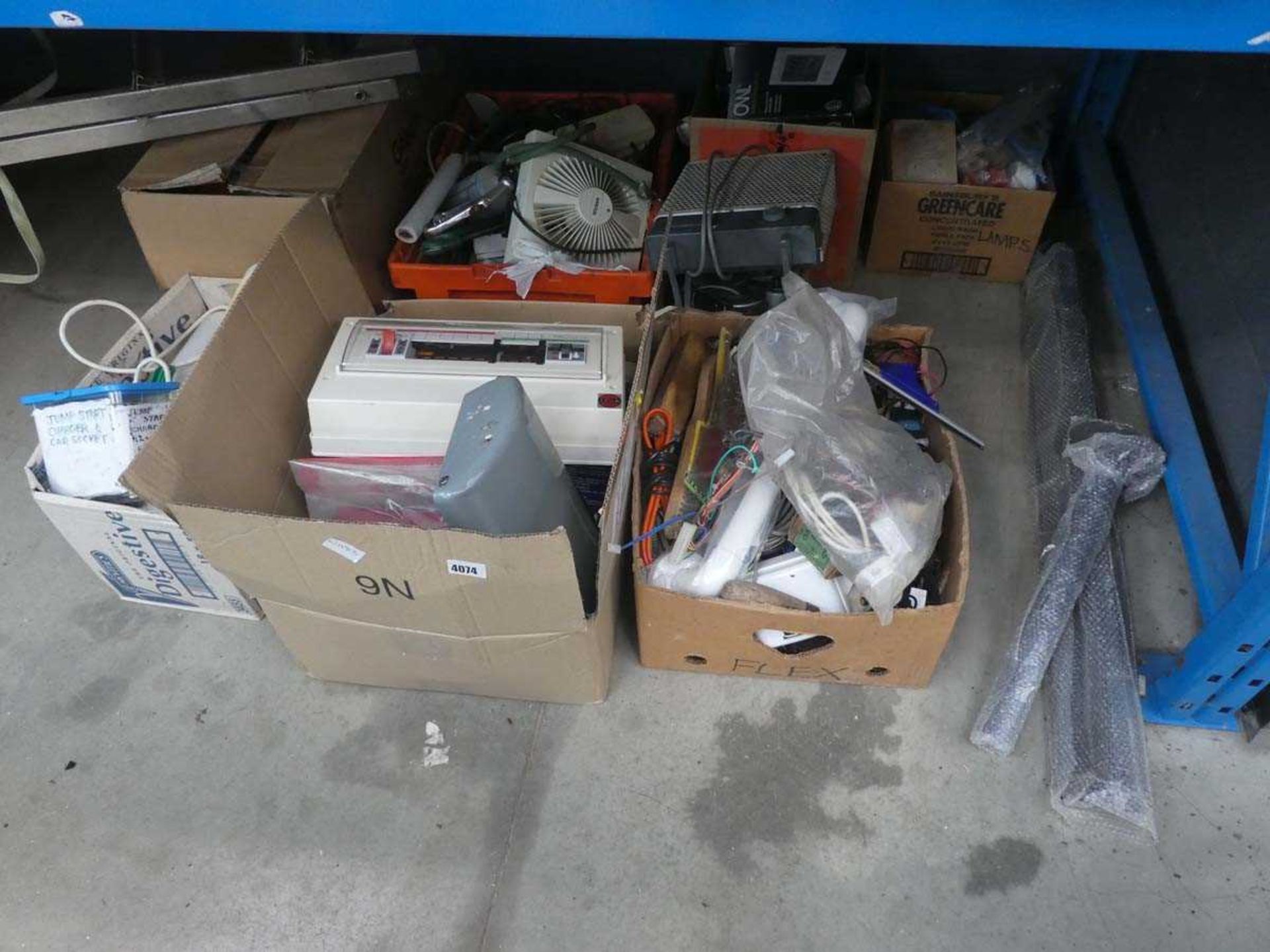 Half an underbay containing various items including switch boxes, fans, heaters, bulbs, grab