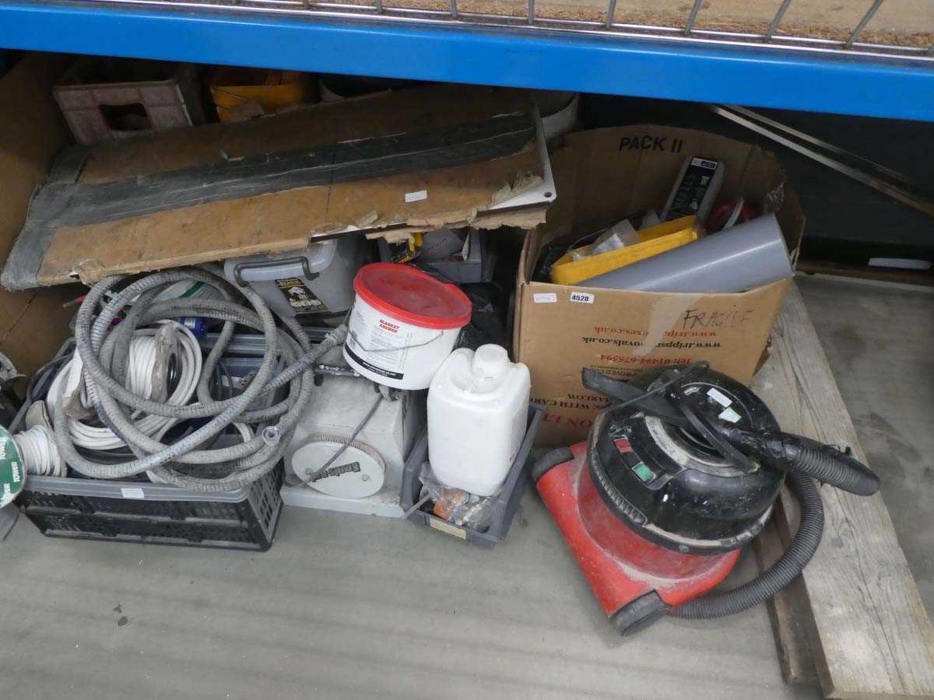 Half an under bay containing cable, hoses, extractors, Henry vacuum cleaner etc