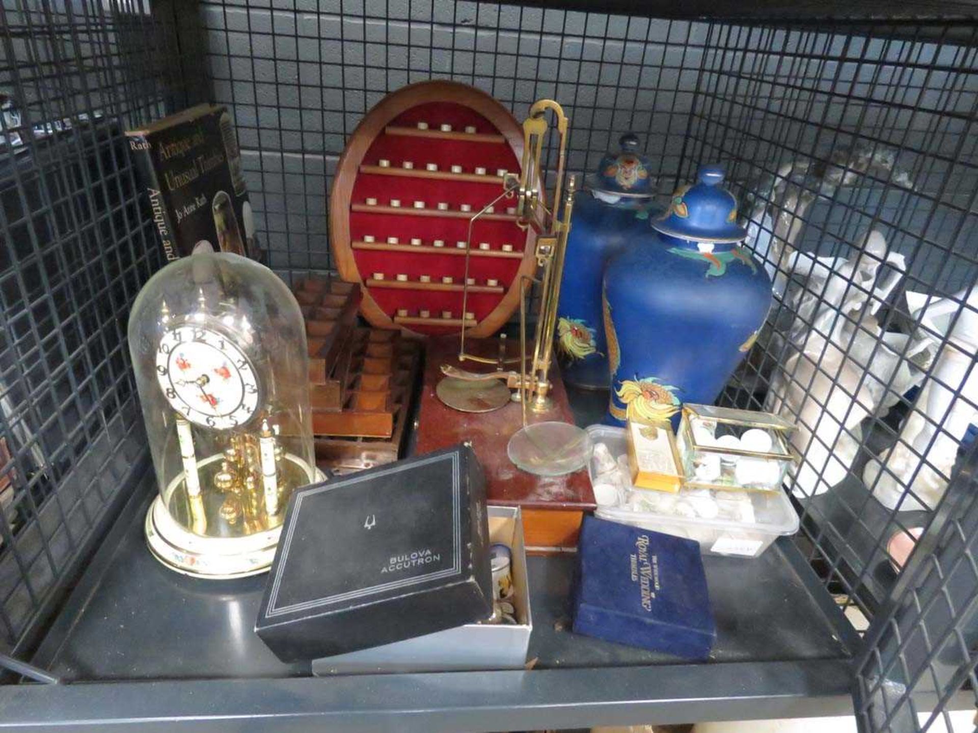 Cage containing quantity of thimbles, lidded vases, set of scales, and Anniversary clock