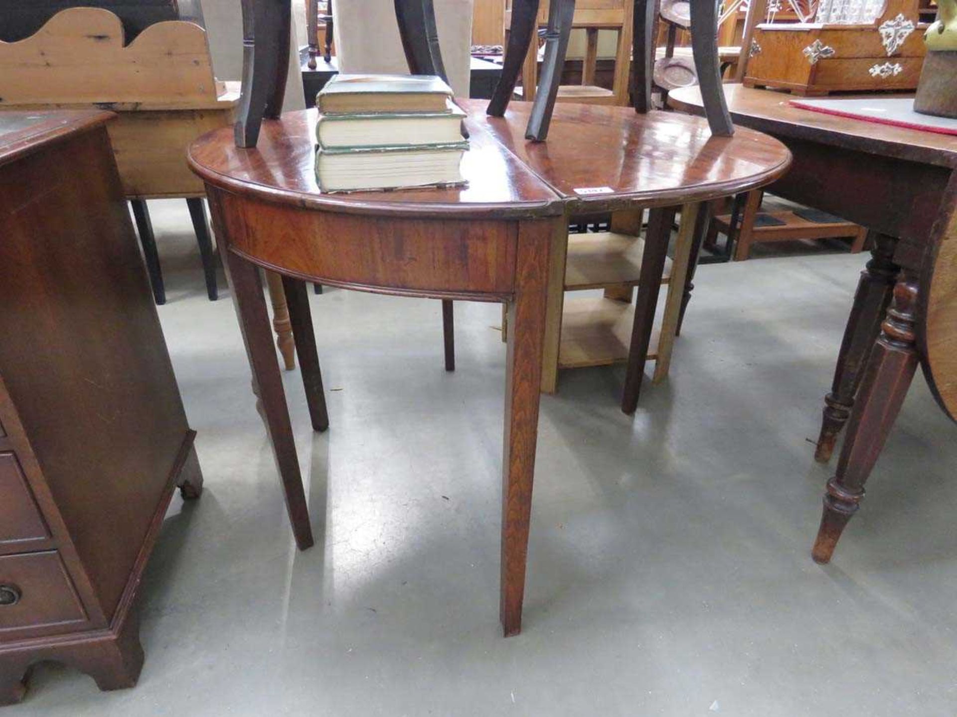 Mahogany demilune table with folding circular top