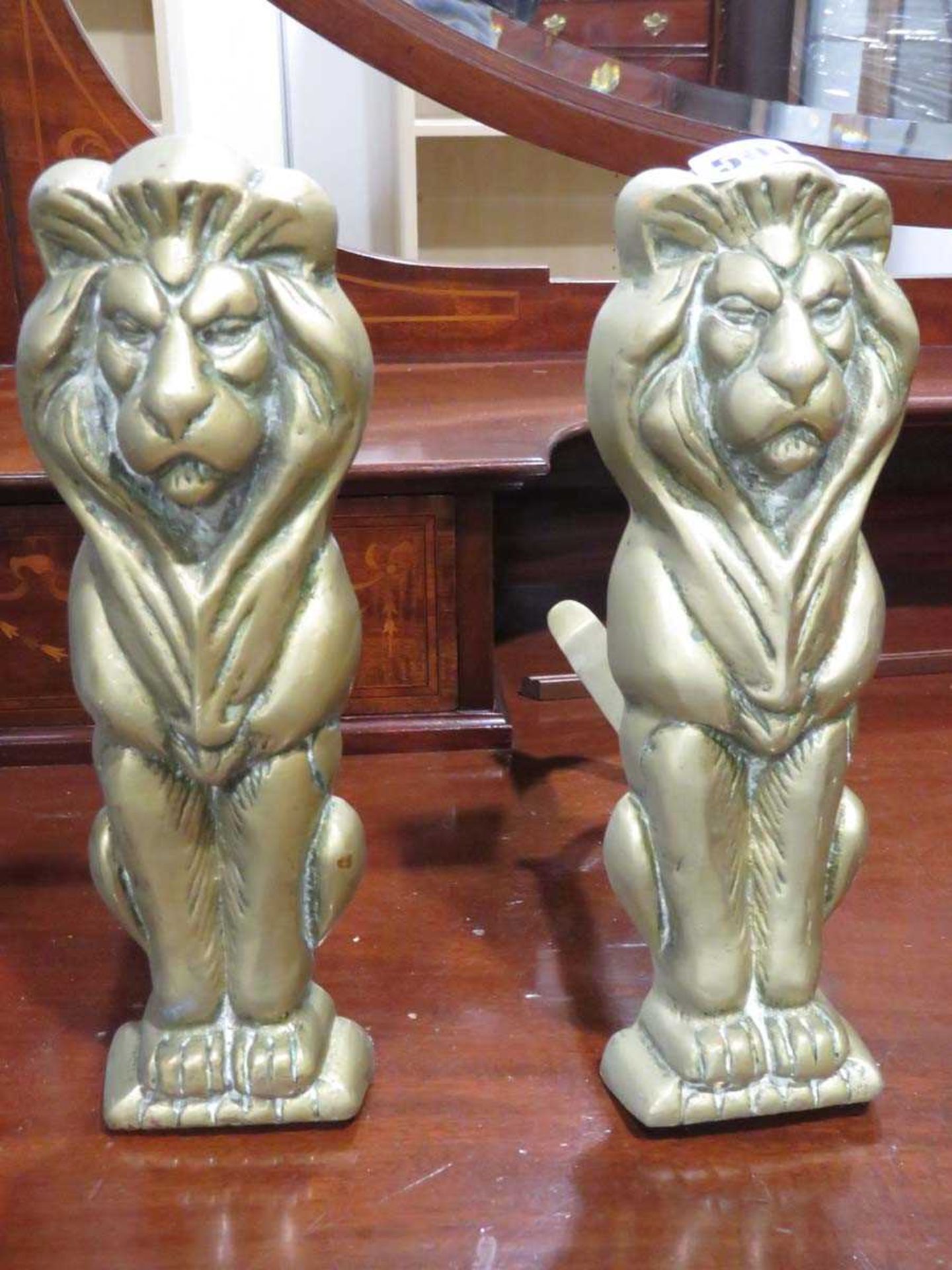 Pair of brass lion fenders