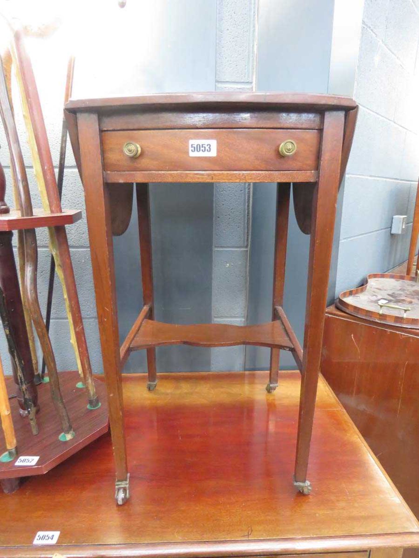 Small Edwardian drop side table on castors with single drawer