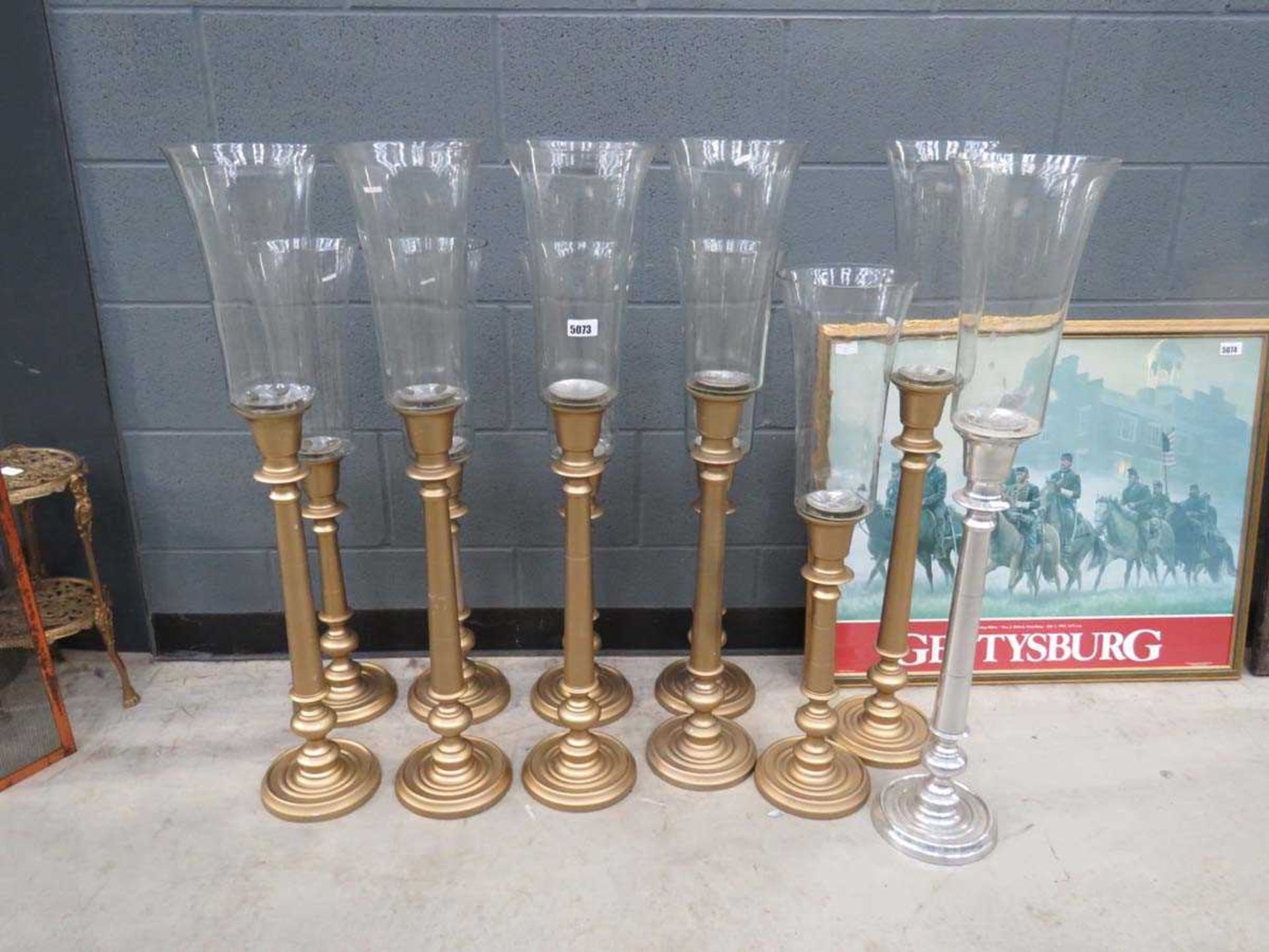 11 gilt painted candle holders with glass shades