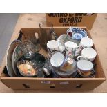 Box containing floral patterned coffee mugs, blue and white china and glassware