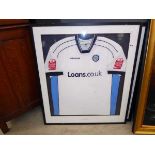 Pair of framed and glazed football shirts