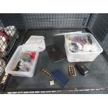 Cage containing military belt, buckles, cloth badges, cigarette case and insignia