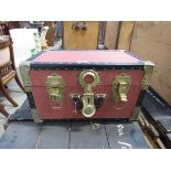 Red painted storage box with brass fittings