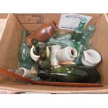 Box containing kitchen storage, pots, glass bottles and boomerang