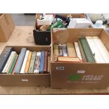 2 x boxes containing dictionaries and novels