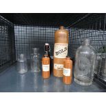 Cage containing gin, beer and other bottles