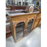 Glazed walnut double door bookcase