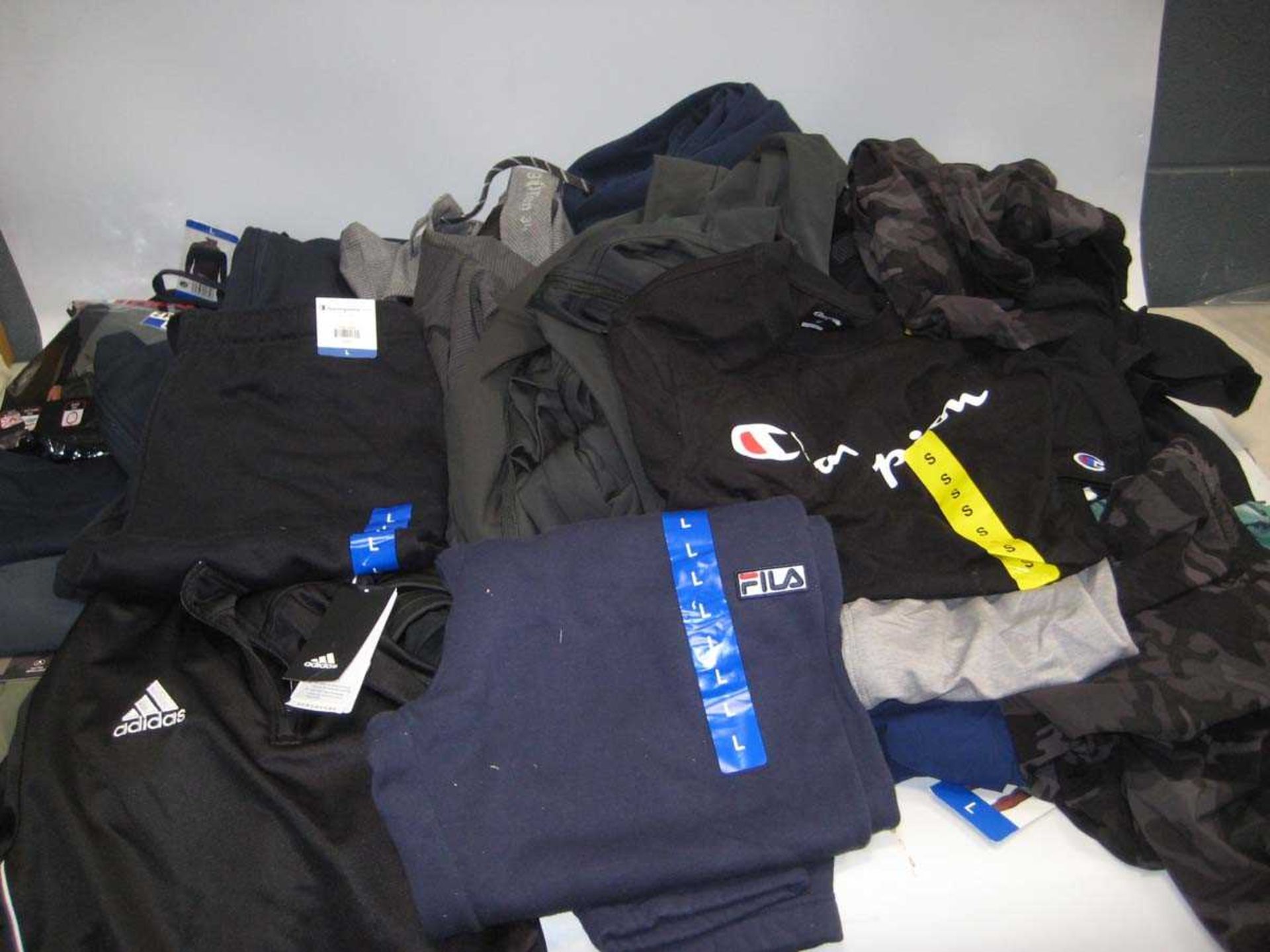 +VAT A bag containing Men's Clothing in various styles and sizes, including Fila, Champion, Adidas