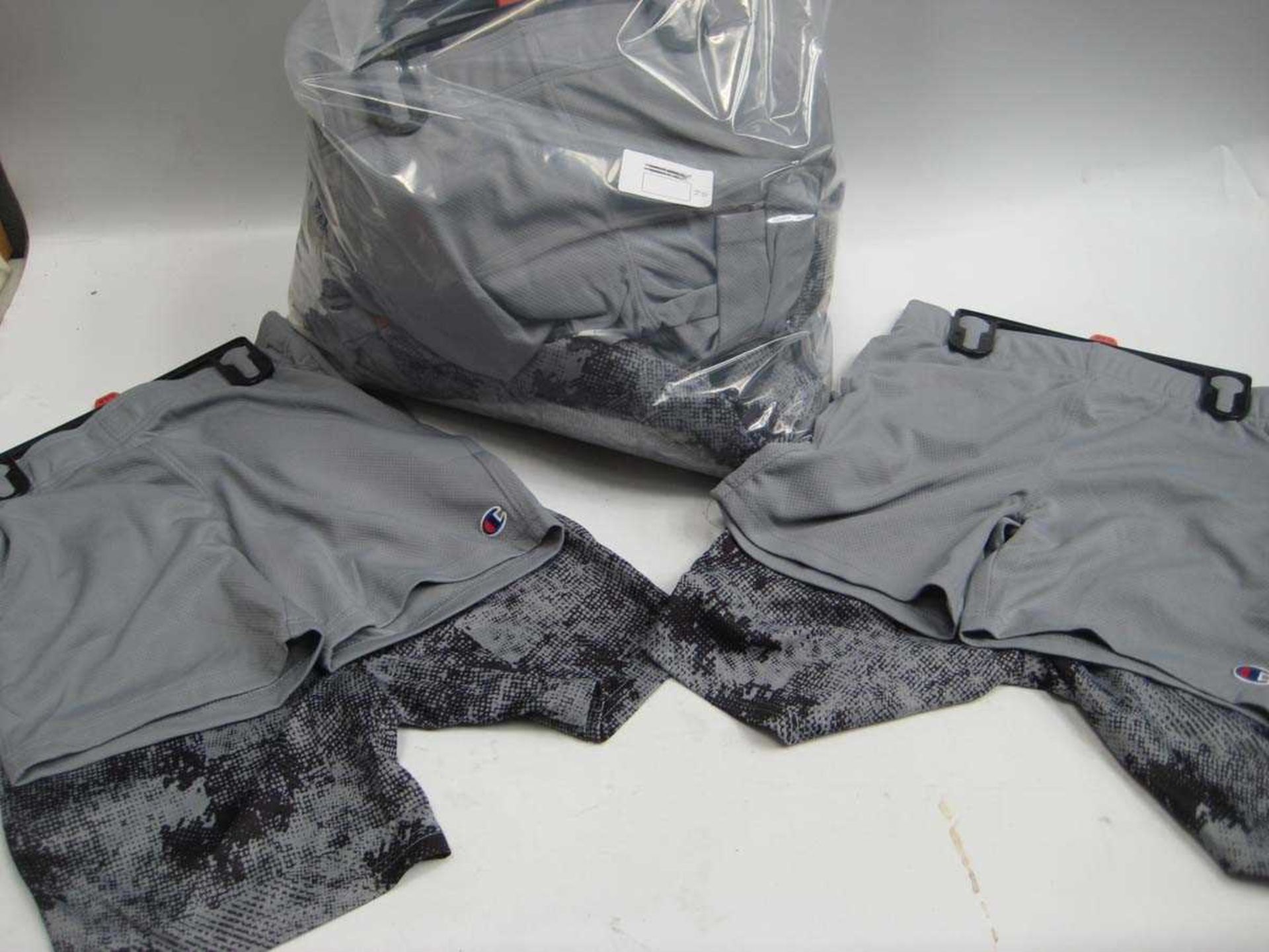A bag containing approx. 20x sets of 2 Boys Champion Shorts in various sizes.