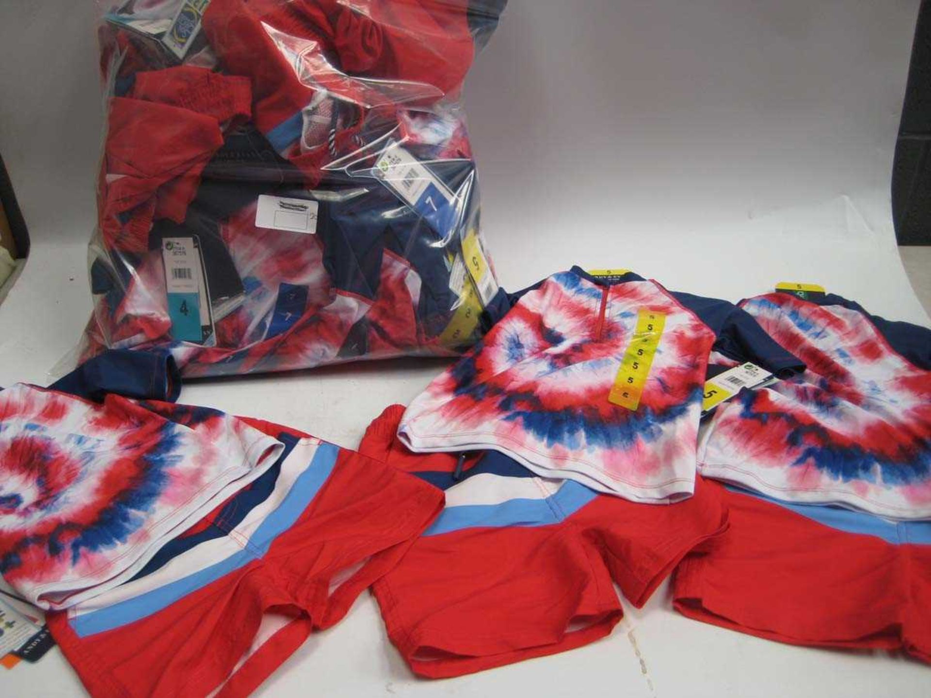 A bag containing 20x sets of Children's Swim Wear in various sizes.