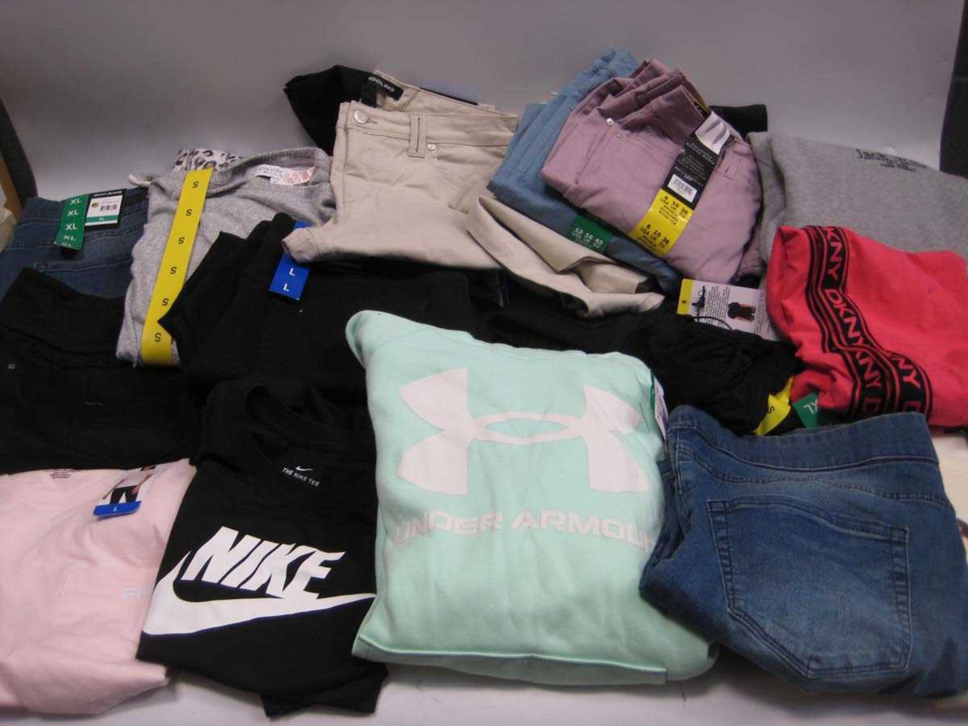 +VAT A bag containing Ladies Clothing in various styles and sizes, including Under Armour, Nike,