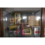 Shelf of vintage children's toys including a Pelham Puppet, die cast vehicles, Corgi fire truck etc