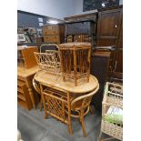 Cane and wicker conservatory table with 2 chairs under, hexagonal side table and a magazine rack
