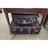 Leather clad travelling case and another similar satchel