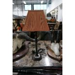 Bronze finish table lamp with pink shade