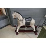 Grey plush rocking horse