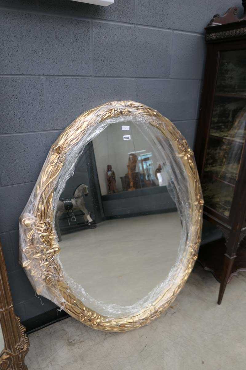 Large oval gilt framed wall mirror