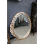 Large oval gilt framed wall mirror