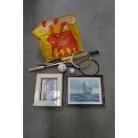 Bag containing squash rackets and prints