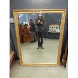 Rectangular gilt framed and bevelled wall mirror