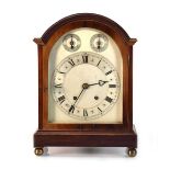 A German bracket clock, the Winterhalder & Hofmeier movement striking on a gong, within a mahogany