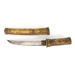 A mid-20th century Japanese tanto-style ceremonial dagger and sheath with incised decorative brass-